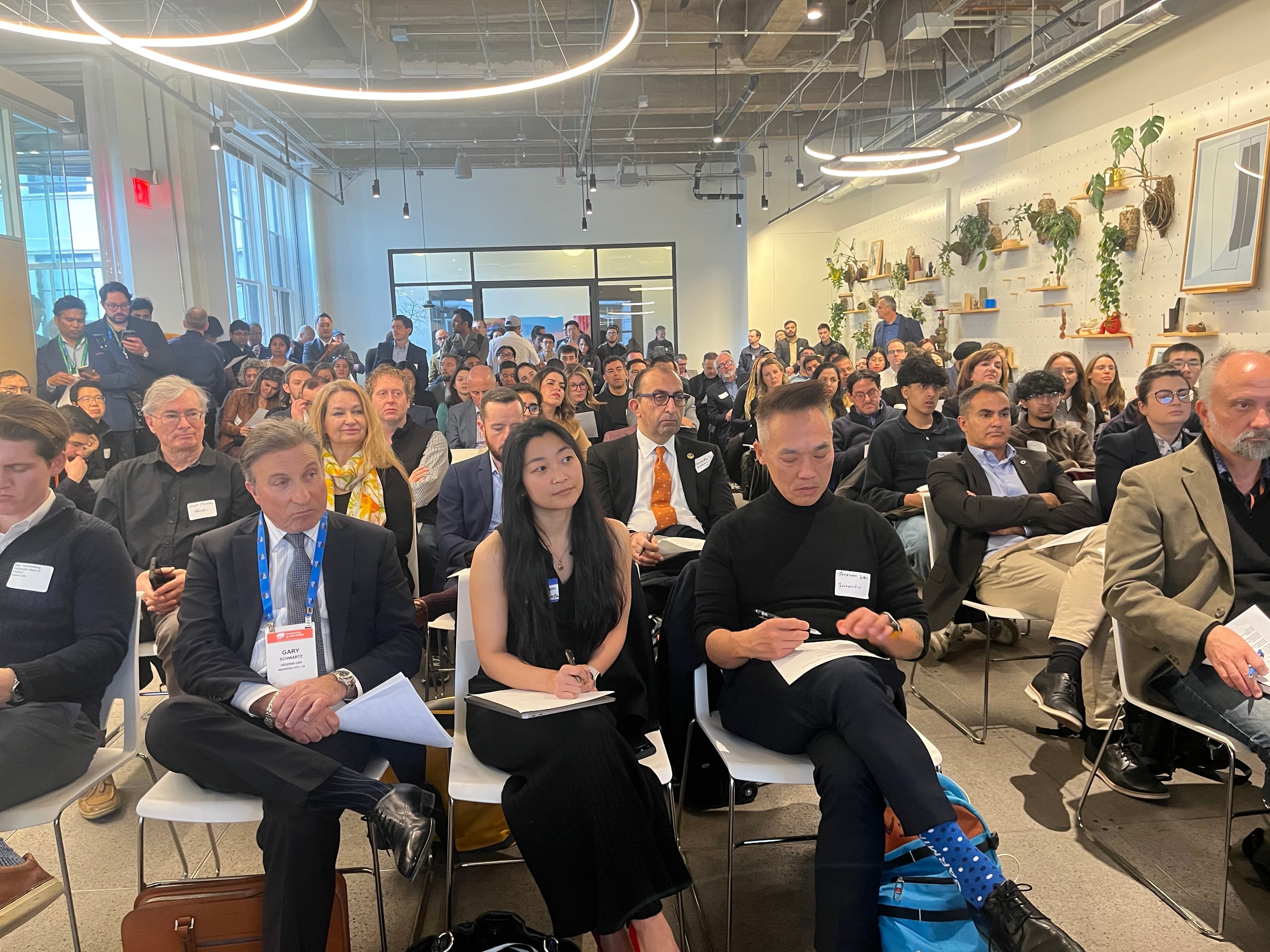 Professionals networking at a venture capital summit